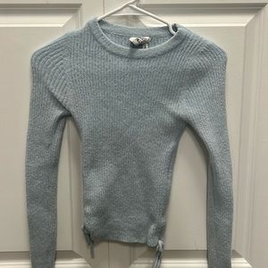 Small cozy blue sweater. Love this color, just a bit too tight on me. Very cozy
